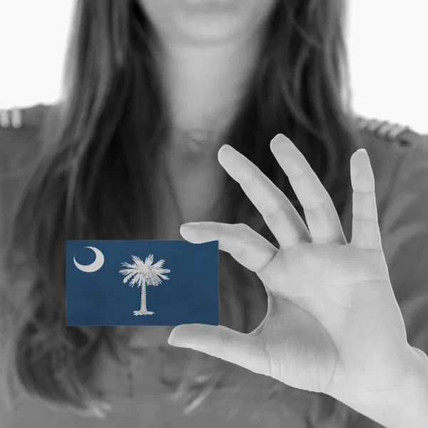 Woman showing a business card — Stock Photo, Image