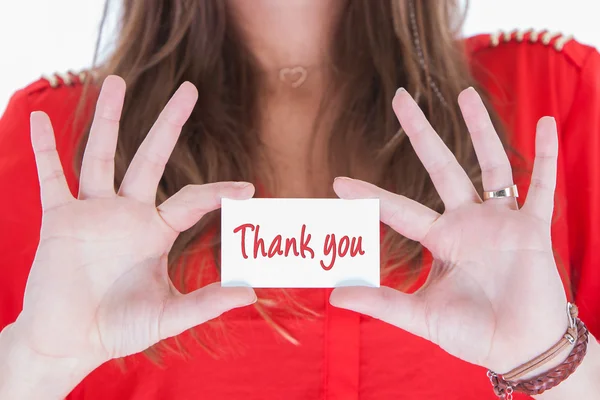 Woman in red showing a business card — Stock Photo, Image