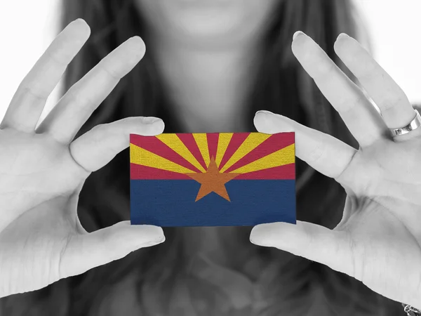 Woman showing a business card — Stock Photo, Image