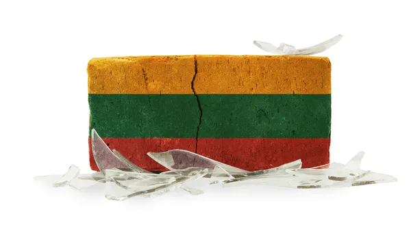 Brick with broken glass, violence concept — Stock Photo, Image