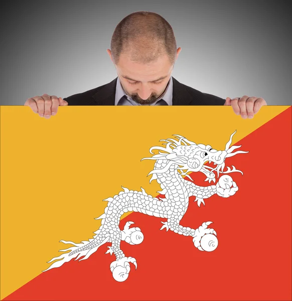 Ler affärsman som innehar stora kort eller flagga — Stockfoto