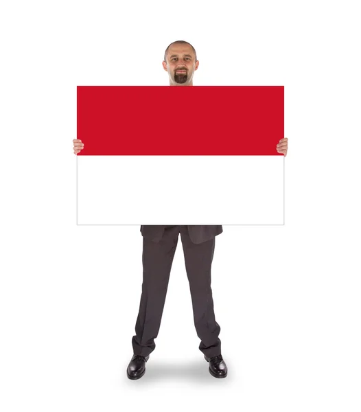 Lächelnder Geschäftsmann mit großer Karte oder Fahne — Stockfoto