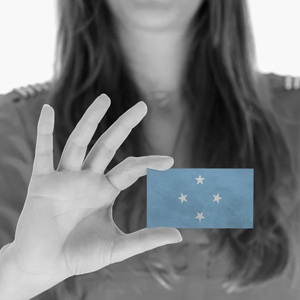 Woman showing a business card — Stock Photo, Image