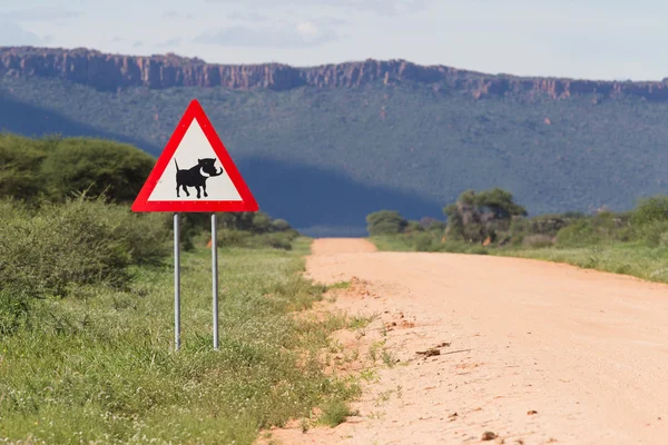 Señal de cruce de Warthog Road —  Fotos de Stock