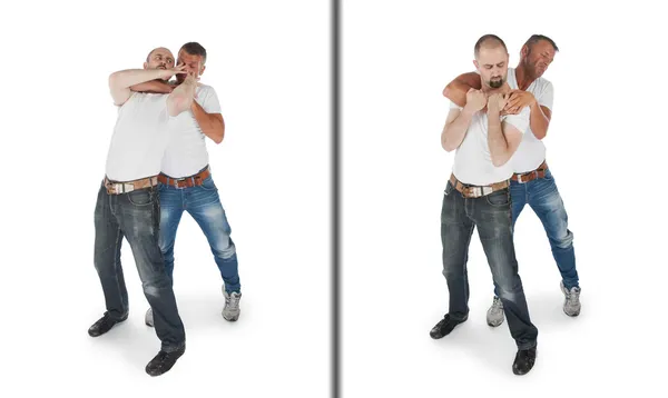 Man defending against a headlock — Stock Photo, Image