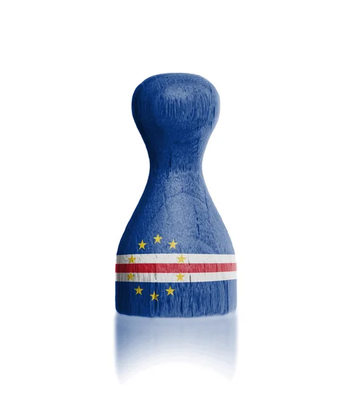 Wooden pawn with a painting of a flag — Stock Photo, Image