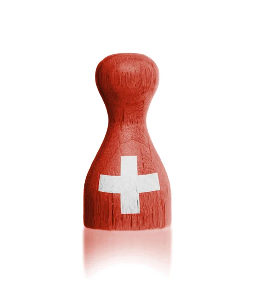 Wooden pawn with a painting of a flag — Stock Photo, Image