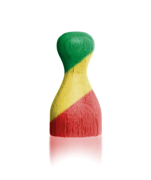 Wooden pawn with a painting of a flag — Stock Photo, Image