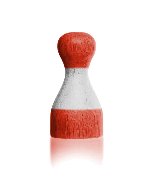 Wooden pawn with a painting of a flag — Stock Photo, Image