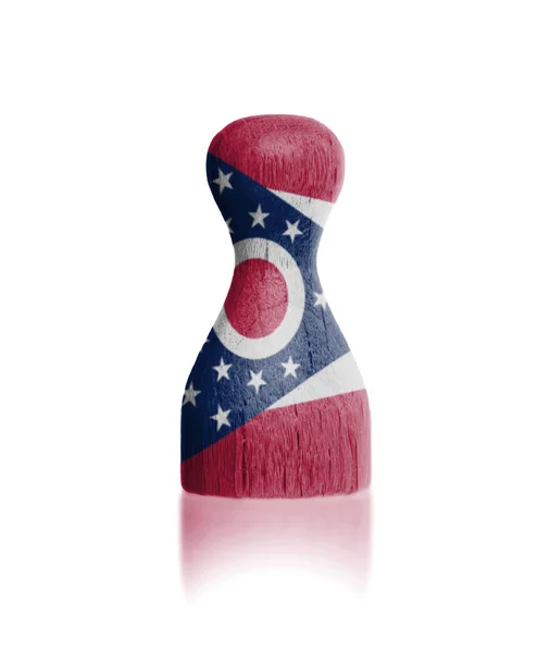 Wooden pawn with a painting of a flag — Stock Photo, Image