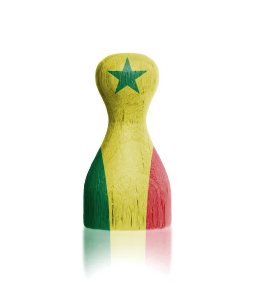 Wooden pawn with a flag painting — Stock Photo, Image