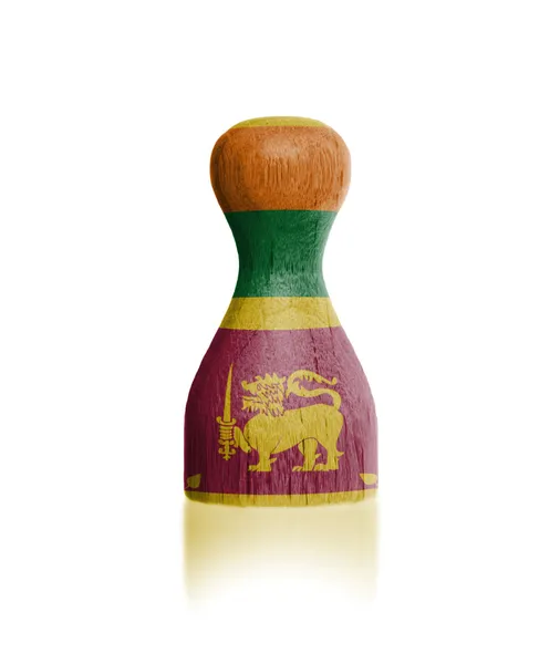 Wooden pawn with a flag painting — Stock Photo, Image