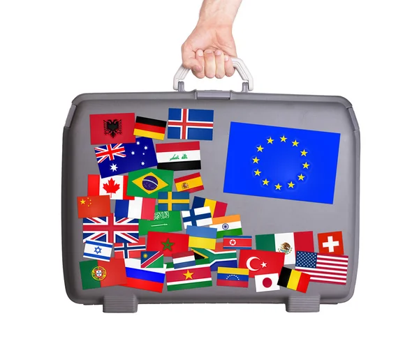 Used plastic suitcase with stickers — Stock Photo, Image