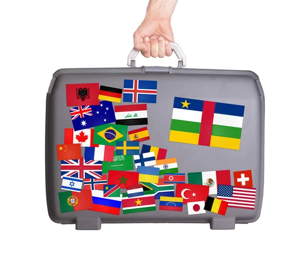 Used plastic suitcase with stickers — Stock Photo, Image