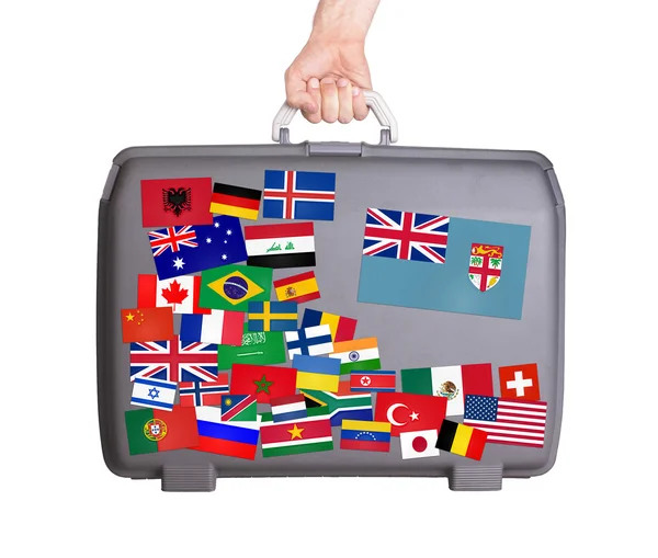 Used plastic suitcase with stickers — Stock Photo, Image