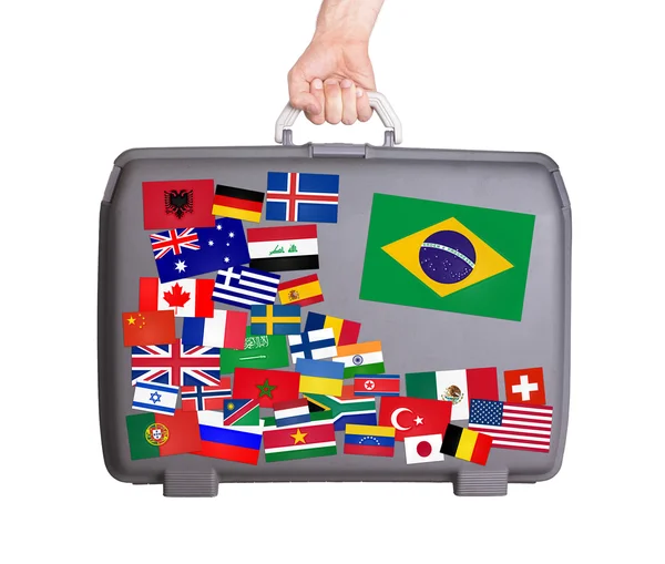 Used plastic suitcase with stickers — Stock Photo, Image