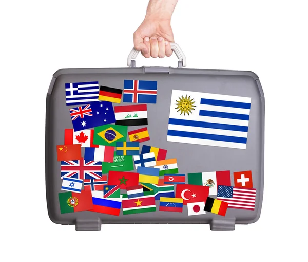 Used plastic suitcase with stickers — Stock Photo, Image