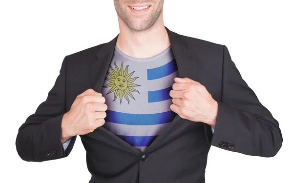 Zakenman opening pak te onthullen shirt met vlag — Stockfoto