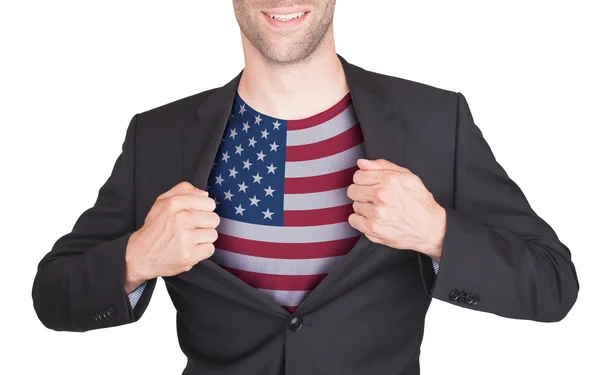 Businessman opening suit to reveal shirt with flag — Stock Photo, Image