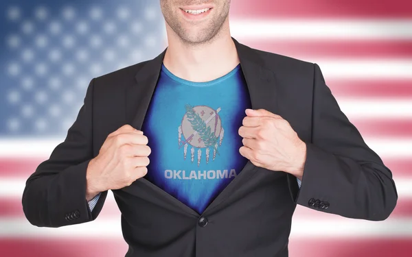 Businessman opening suit to reveal shirt with state flag — Stock Photo, Image