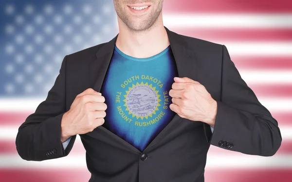 Hombre de negocios abriendo traje para revelar camisa con bandera estatal — Foto de Stock