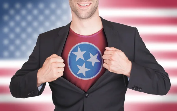 Businessman opening suit to reveal shirt with state flag — Stock Photo, Image