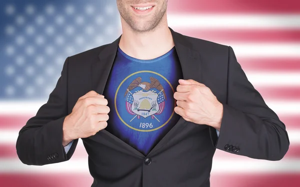 Businessman opening suit to reveal shirt with state flag — Stock Photo, Image