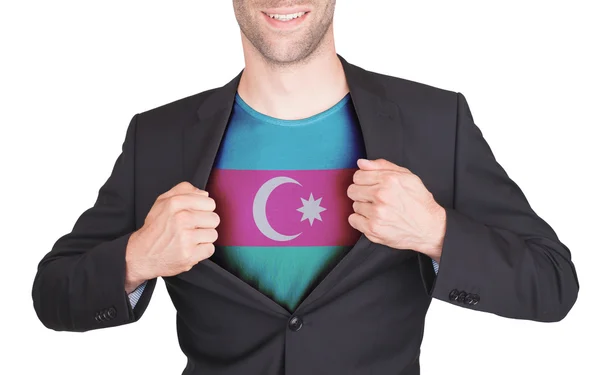 Zakenman opening pak te onthullen shirt met vlag — Stockfoto