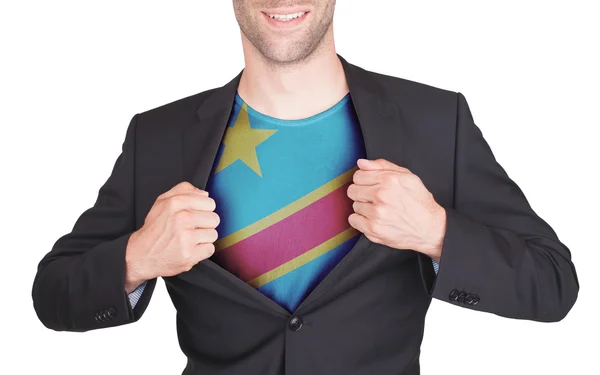 Hombre de negocios abriendo traje para revelar camisa con bandera — Foto de Stock