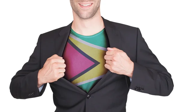 Businessman opening suit to reveal shirt with flag — Stock Photo, Image