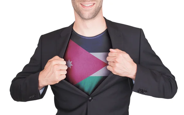 Zakenman opening pak te onthullen shirt met vlag — Stockfoto