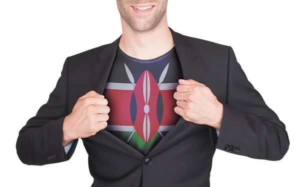 Businessman opening suit to reveal shirt with flag — Stock Photo, Image