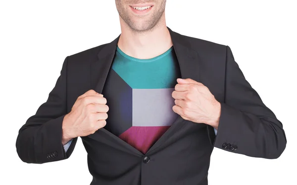 Zakenman opening pak te onthullen shirt met vlag — Stockfoto