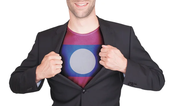 Businessman opening suit to reveal shirt with flag — Stock Photo, Image