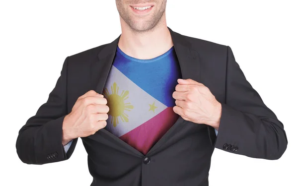 Zakenman opening pak te onthullen shirt met vlag — Stockfoto