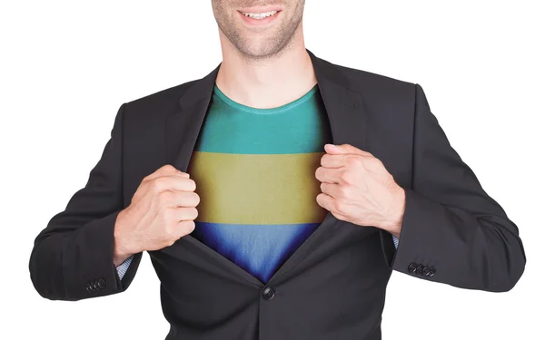 Podnikatel otevírání oblek odhalit tričko s příznakem — Stock fotografie