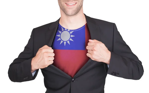 Businessman opening suit to reveal shirt with flag — Stock Photo, Image