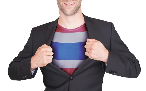 Businessman opening suit to reveal shirt with flag — Stock Photo, Image