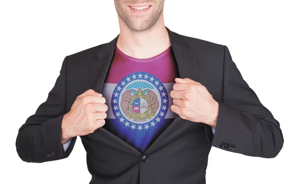 Hombre de negocios abriendo traje para revelar camisa con bandera estatal —  Fotos de Stock