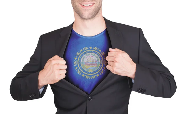 Businessman opening suit to reveal shirt with state flag — Stock Photo, Image