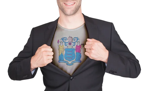 Businessman opening suit to reveal shirt with state flag — Stock Photo, Image