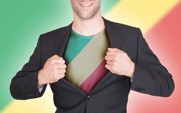 Uomo d'affari vestito di apertura per rivelare la camicia con bandiera — Foto Stock