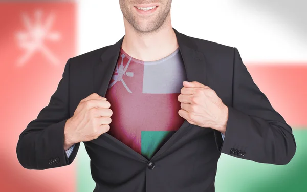 Hombre de negocios abriendo traje para revelar camisa con bandera —  Fotos de Stock