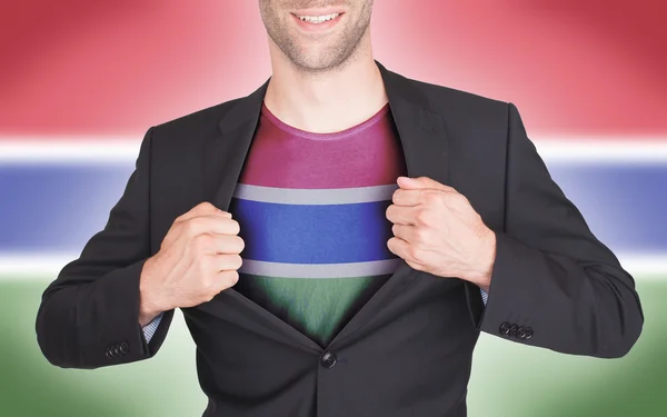 Businessman opening suit to reveal shirt with flag — Stock Photo, Image