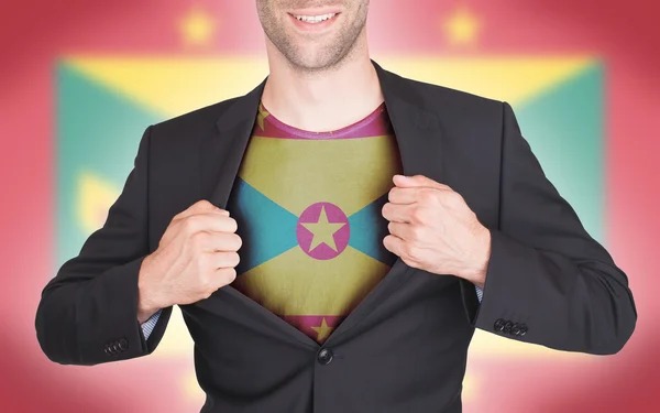 Hombre de negocios abriendo traje para revelar camisa con bandera — Foto de Stock