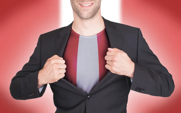 Geschäftsmann öffnet Anzug, um Hemd mit Fahne zu enthüllen — Stockfoto