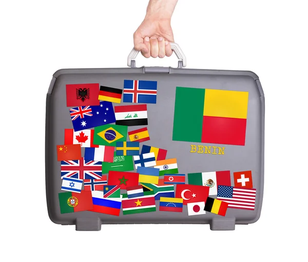 Used plastic suitcase with stickers — Stock Photo, Image