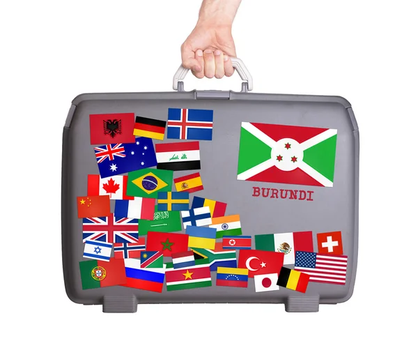 Used plastic suitcase with stickers — Stock Photo, Image