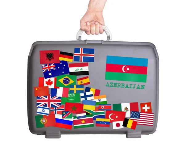 Used plastic suitcase with stickers — Stock Photo, Image