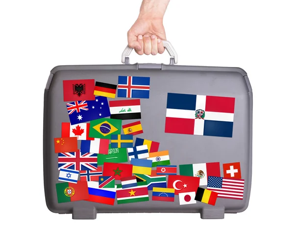 Used plastic suitcase with stickers — Stock Photo, Image